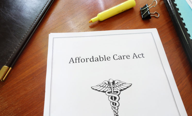 Affordable Care Act document on an office desk